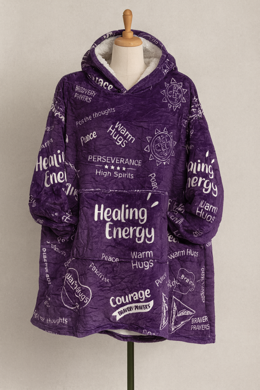Purple hoodie with motivational text on a mannequin against a plain background