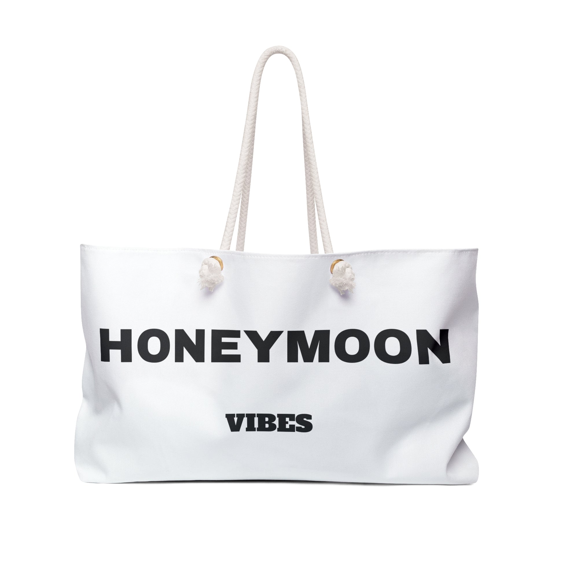 White tote bag with 'Honeymoon Vibes' text on a white background