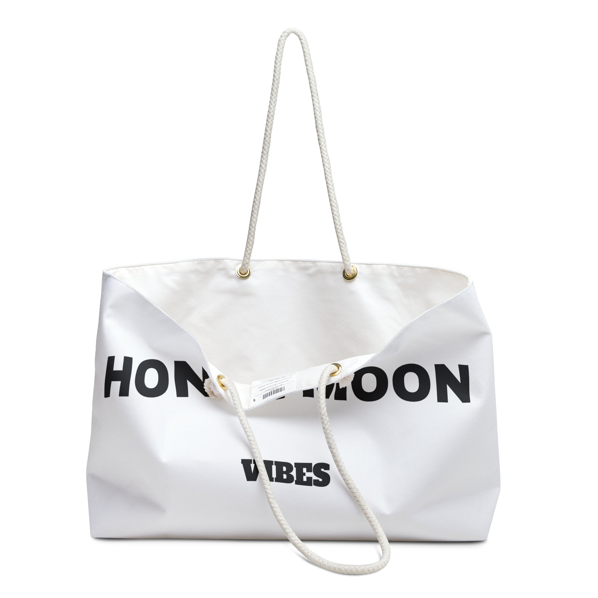 White tote bag with 'Honeymoon Vibes' text on a white background