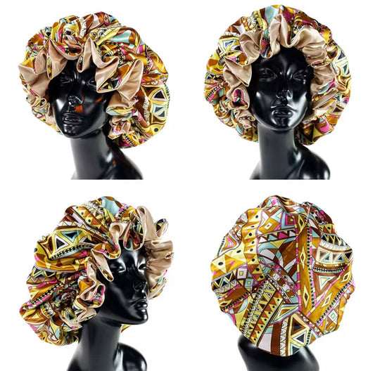 Four mannequin heads wearing colorful patterned bonnets on a white background